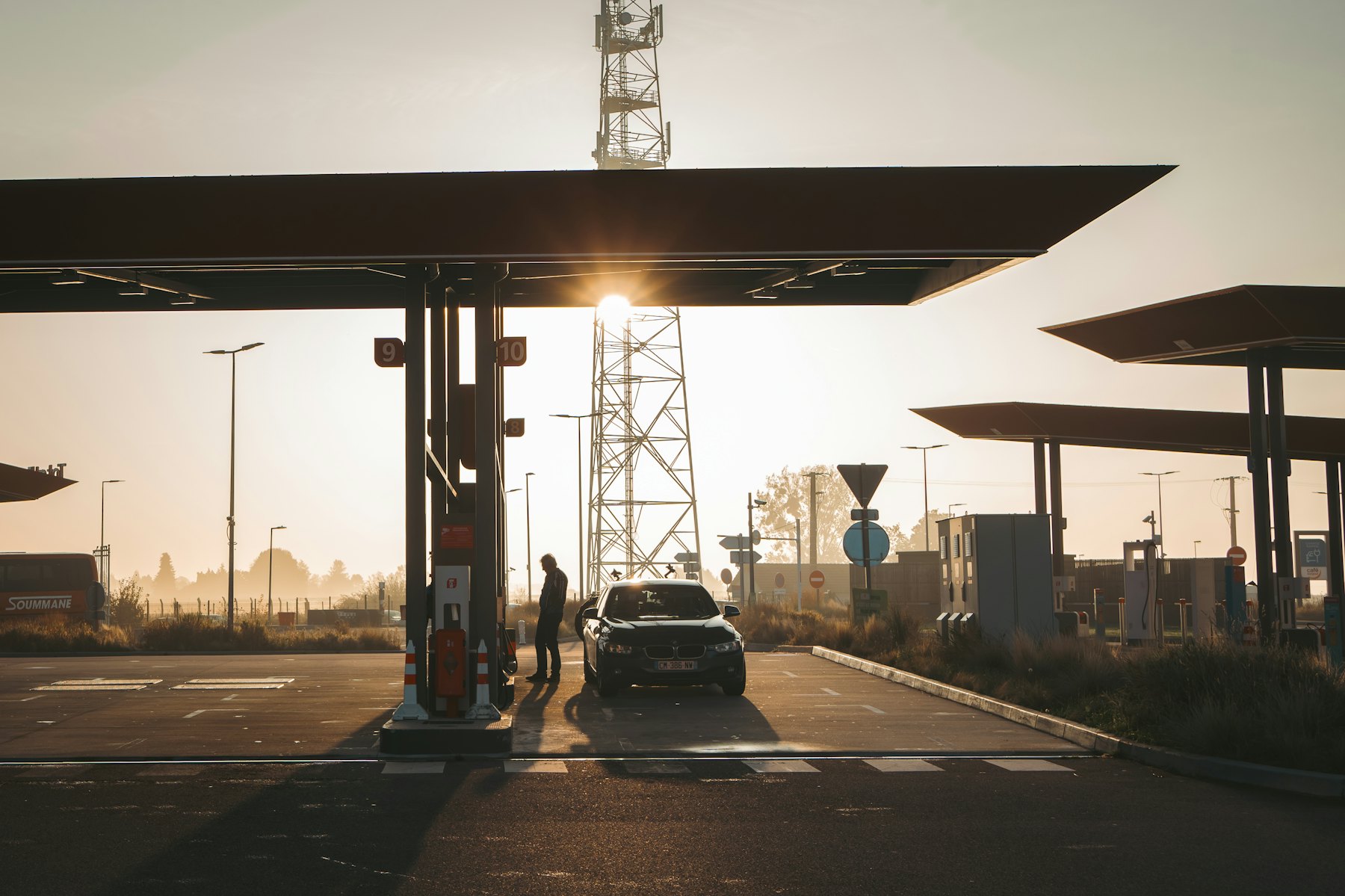 A filling station forecourt at sunset